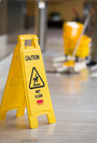 Panneau d'avertissement avec mention Wet Floor/Caution